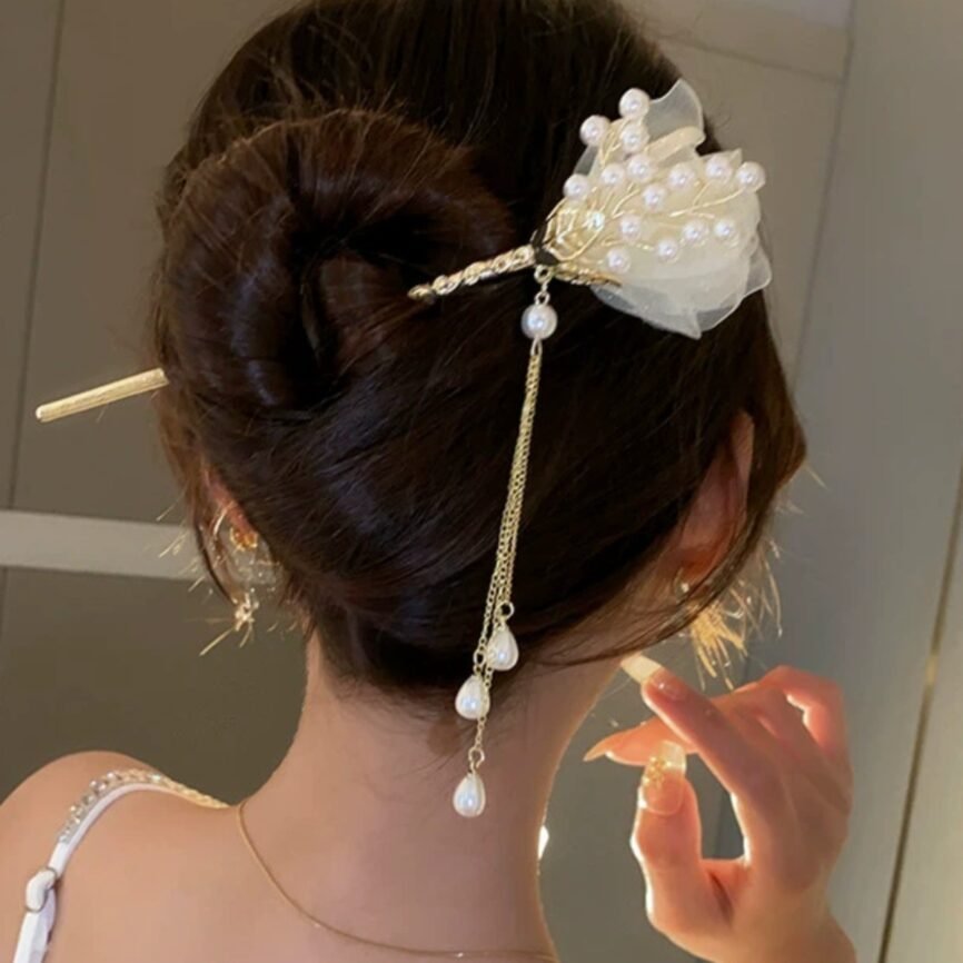 Blue celestial flow pearl hairpin with cosmic charm close-up.
