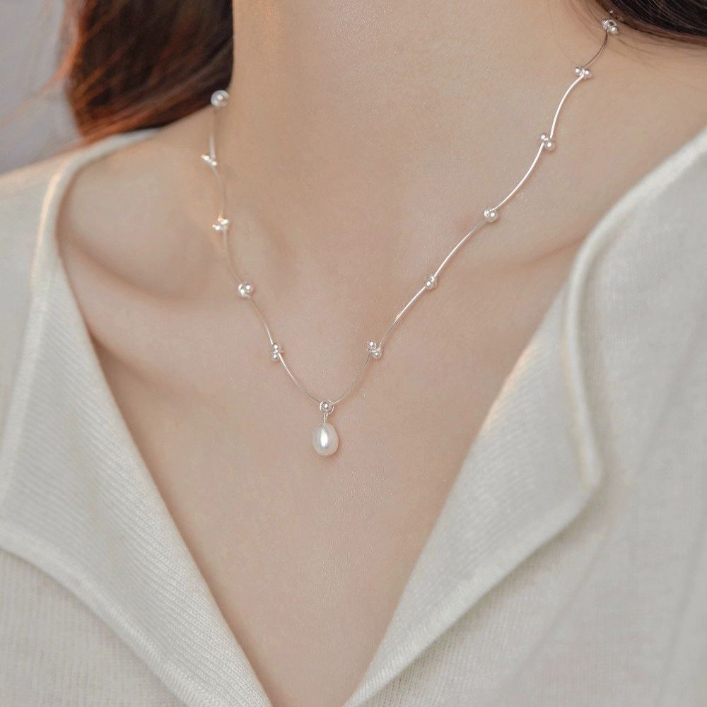 Blue Celestial Nexus Heart Chain necklace with cosmic charm and secure necklace backing.