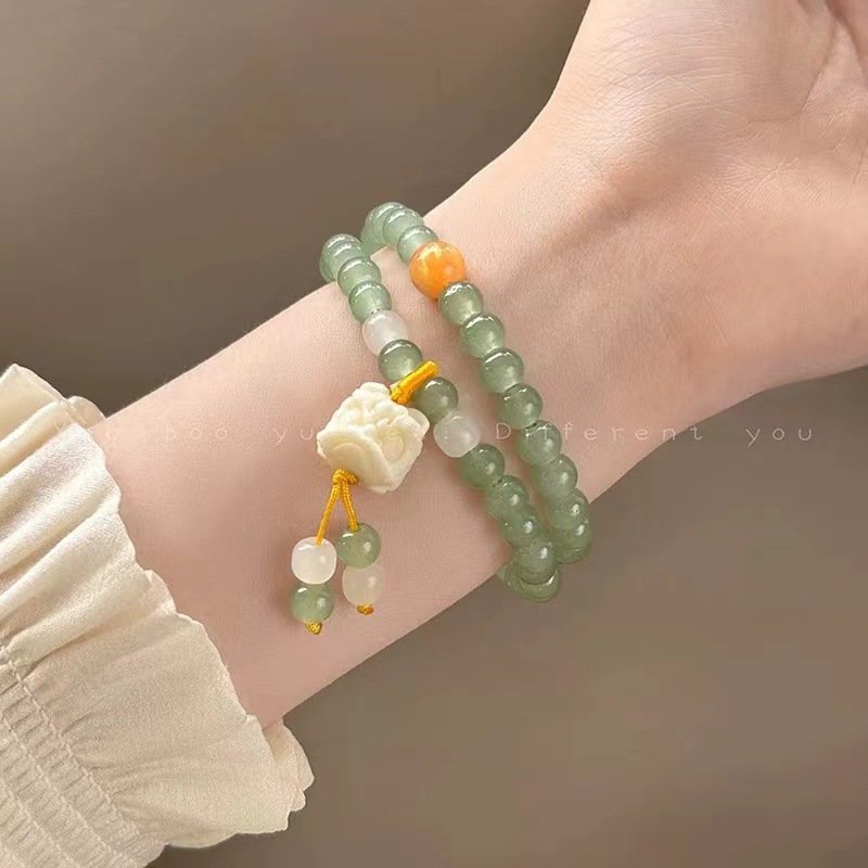 Blue Harmonic Lion Dance charm bangle bracelet with double loops.