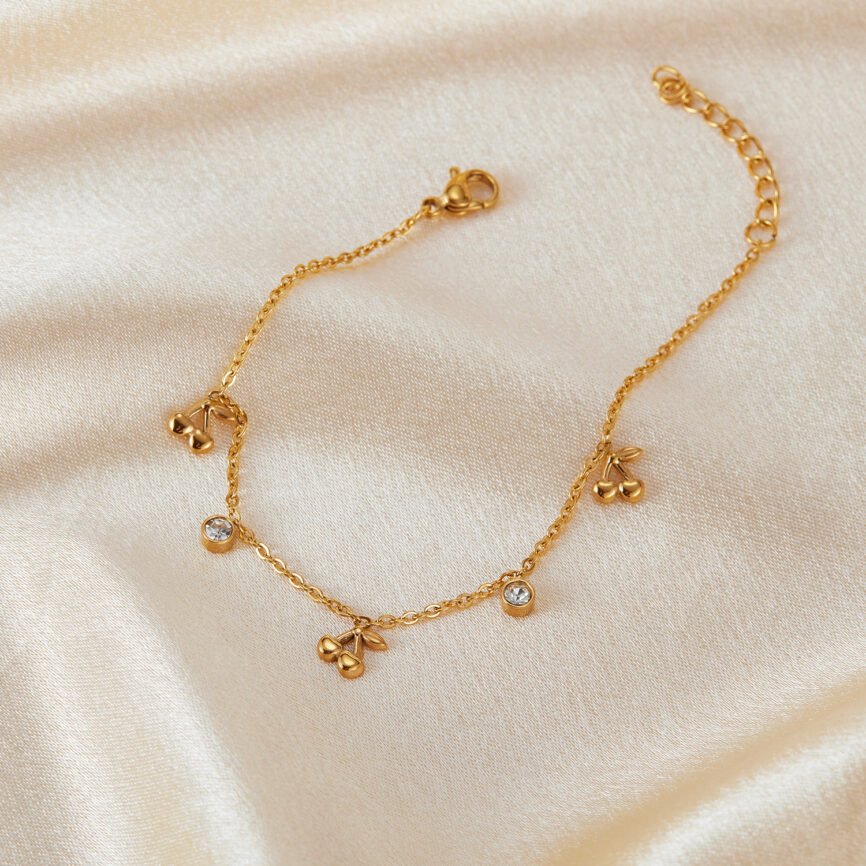Blue Mystic Cherry Lumisphere bangle bracelet with charm close-up.