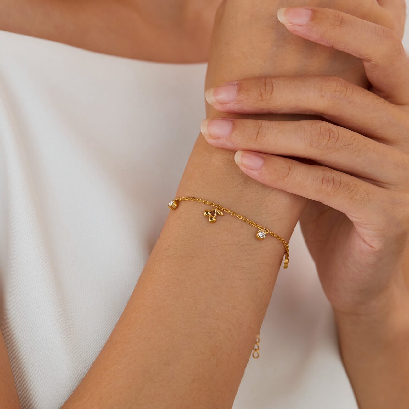 Blue Mystic Cherry Lumisphere bangle bracelet with charm close-up.