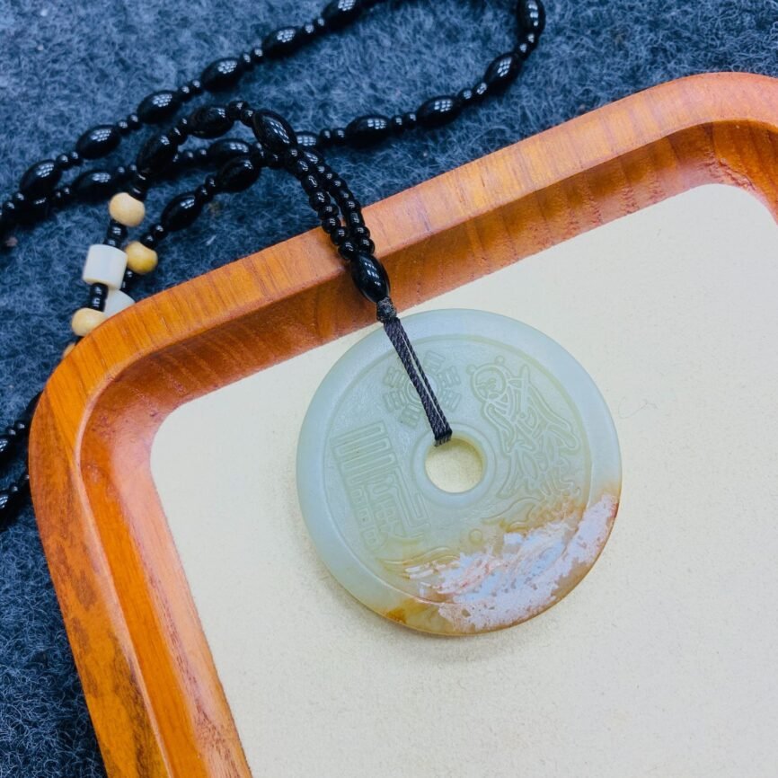 Blue Mystic Veil Mountain coin pendant with mystical charm details.