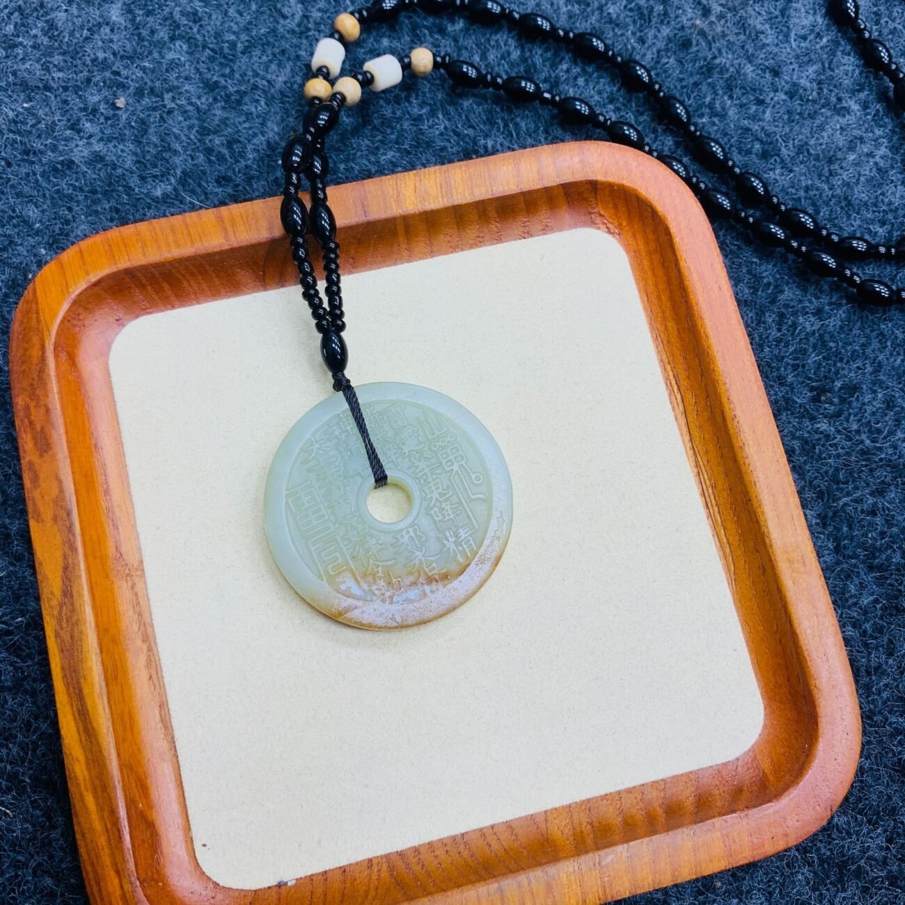 Blue Mystic Veil Mountain coin pendant with mystical engravings.