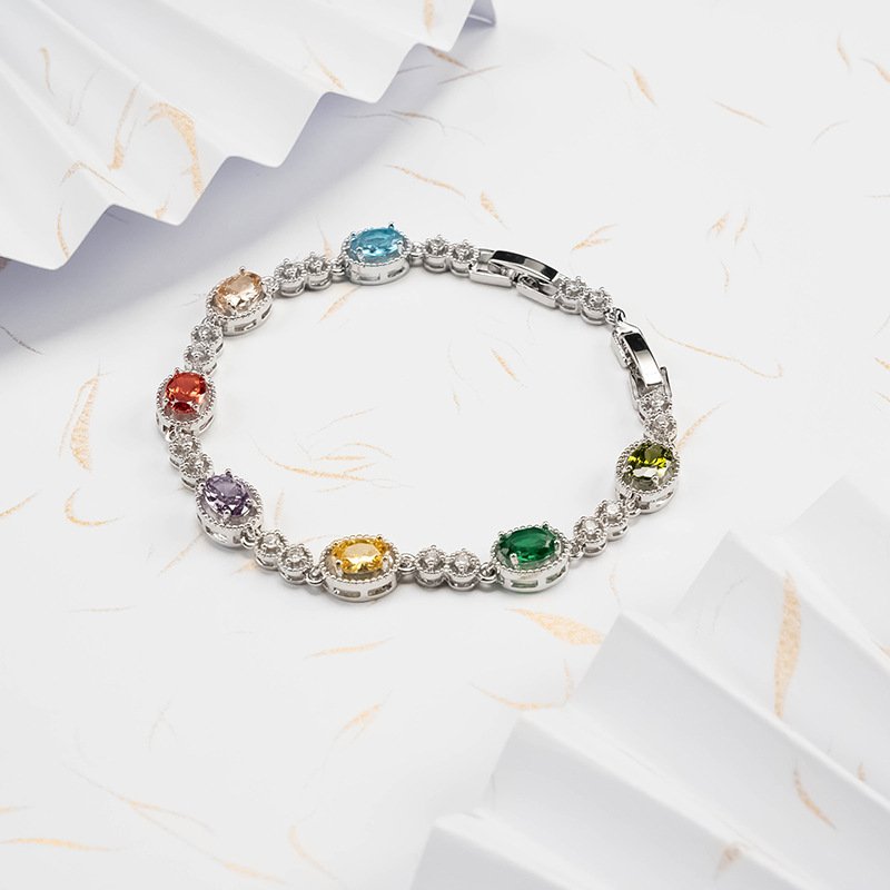 Blue celestial silv charm bracelet with artisan details for fortune.