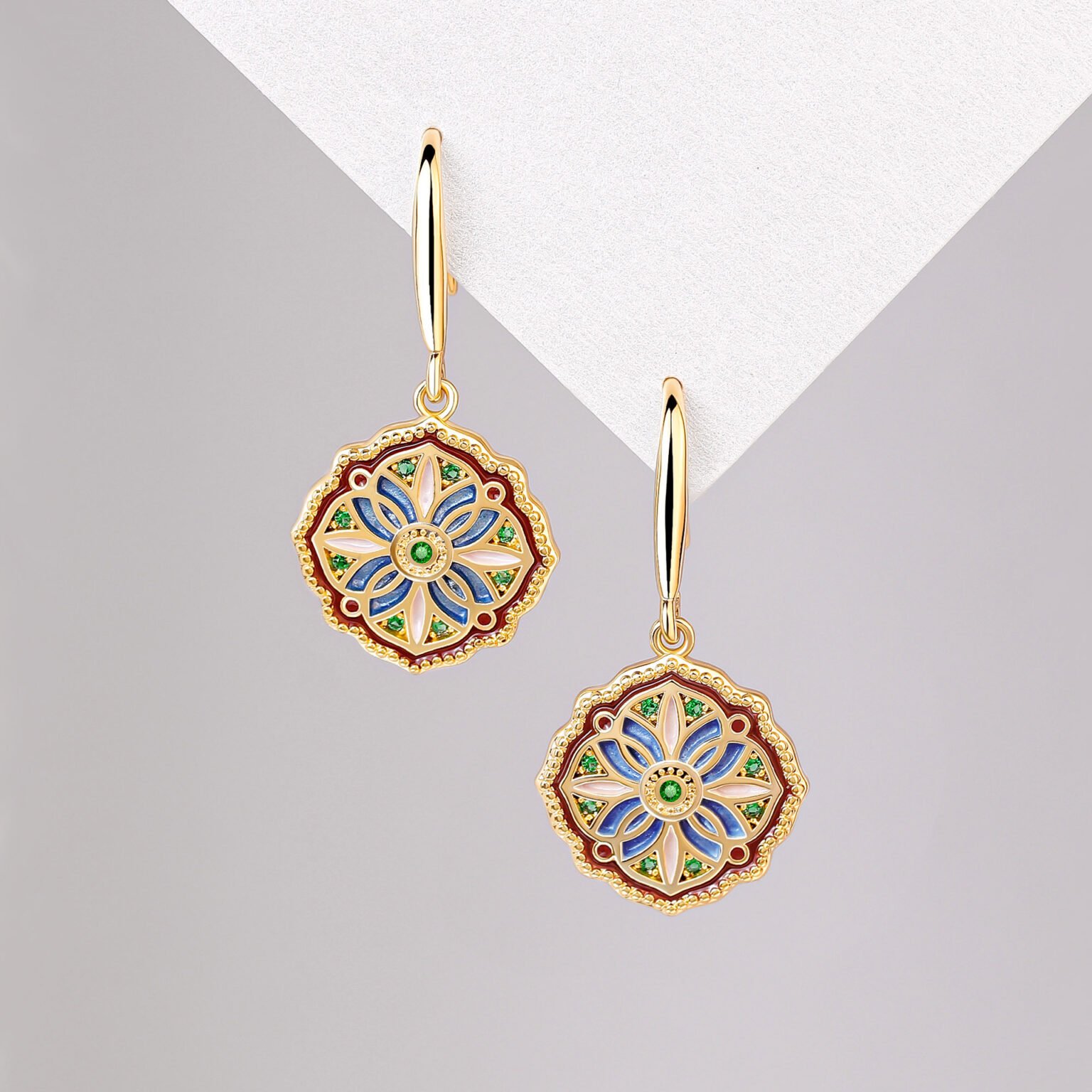 Blue Mystic Pearl Moonlit Duo earrings with gold accents and jade charm.