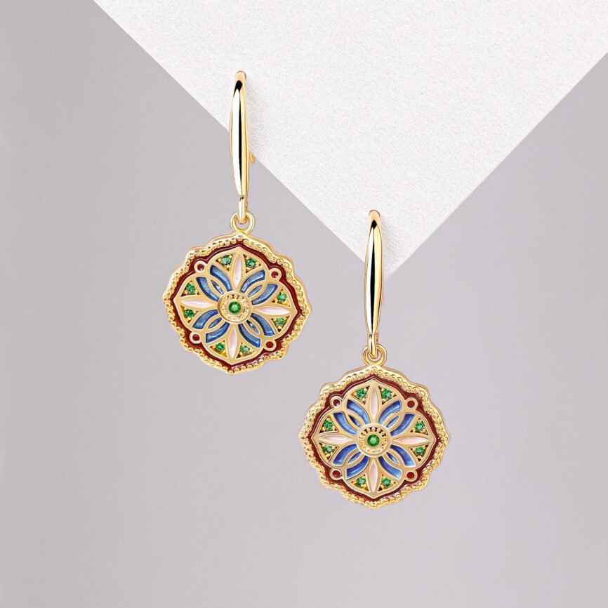 Blue Mystic Pearl Moonlit Duo earrings with gold accents and jade charm.