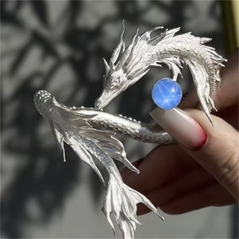 Celestial Harmony Charm Bracelet with intricate Chinese cosmic artistry, blue close-up.