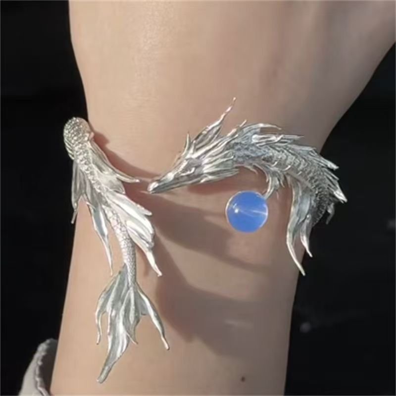 Celestial Harmony Charm Bracelet with intricate Chinese cosmic artistry, blue variant.
