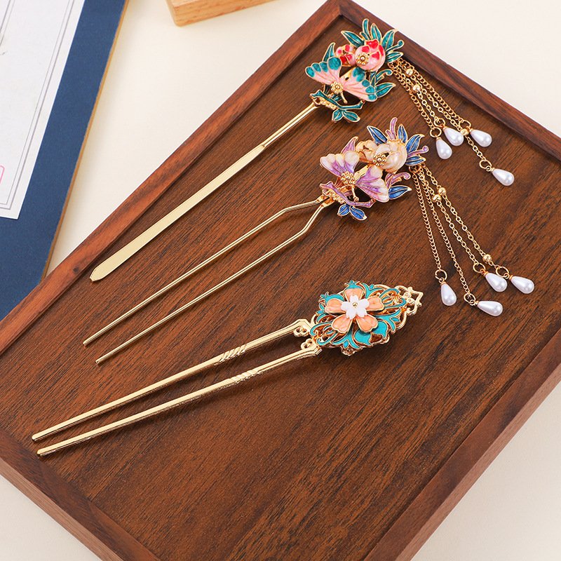 Blue celestial crane hairpin with cloud motifs, symbolizing harmony.