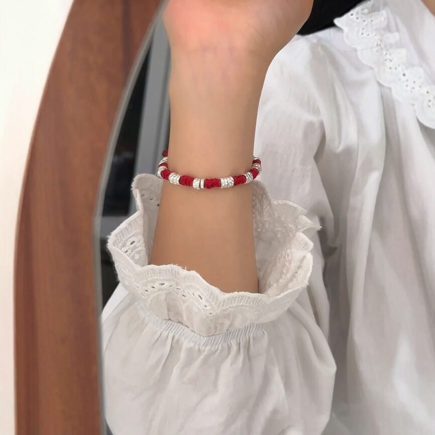 Blue Eternal Twist Lucky Charm Bracelet with intricate artisan details for fortune.