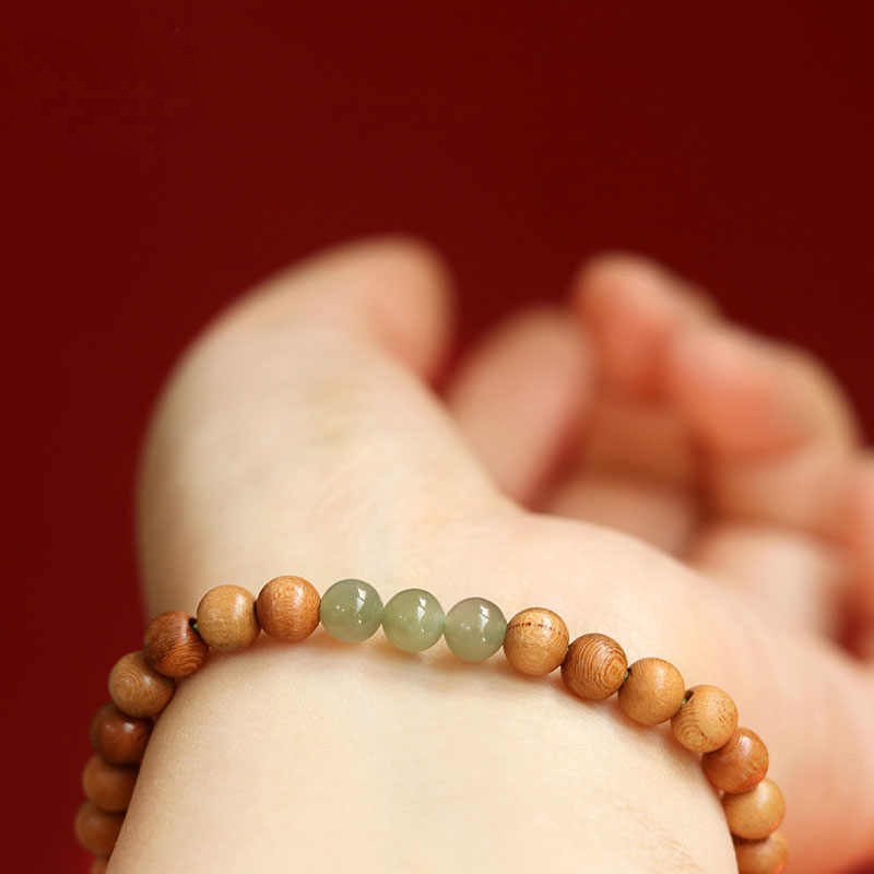 Harmony Cloud jade and peachwood bangle bracelet with charm for wealth.