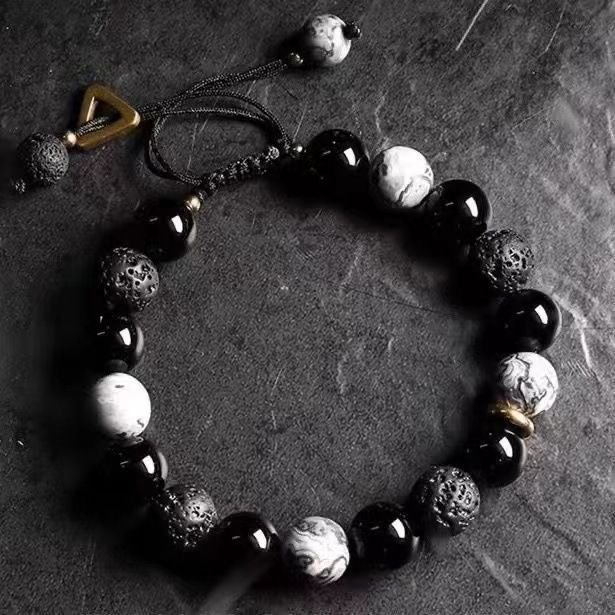 Blue Mystic Ember Harmony lava bangle bracelet with charm, balancing elements.