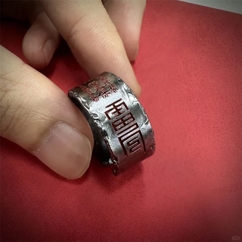 Blue Stormpeak Mystic Ring with intricate artisan details, emerald-cut gemstone.